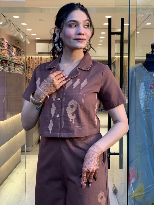 Woman wearing cotton embroidered shirt and plazzo cord set