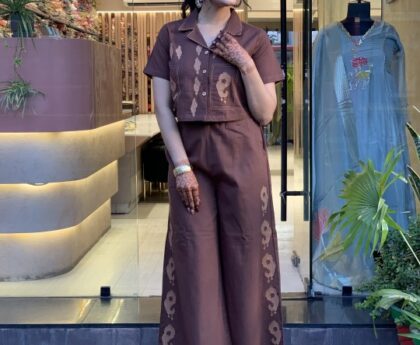 Woman wearing cotton embroidered shirt and plazzo cord set