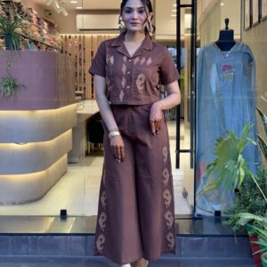 Woman wearing cotton embroidered shirt and plazzo cord set